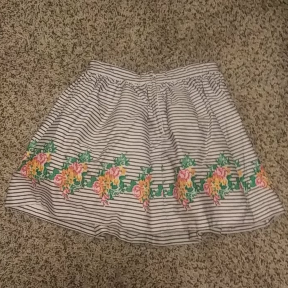 Striped skirt with flowers at the bottom